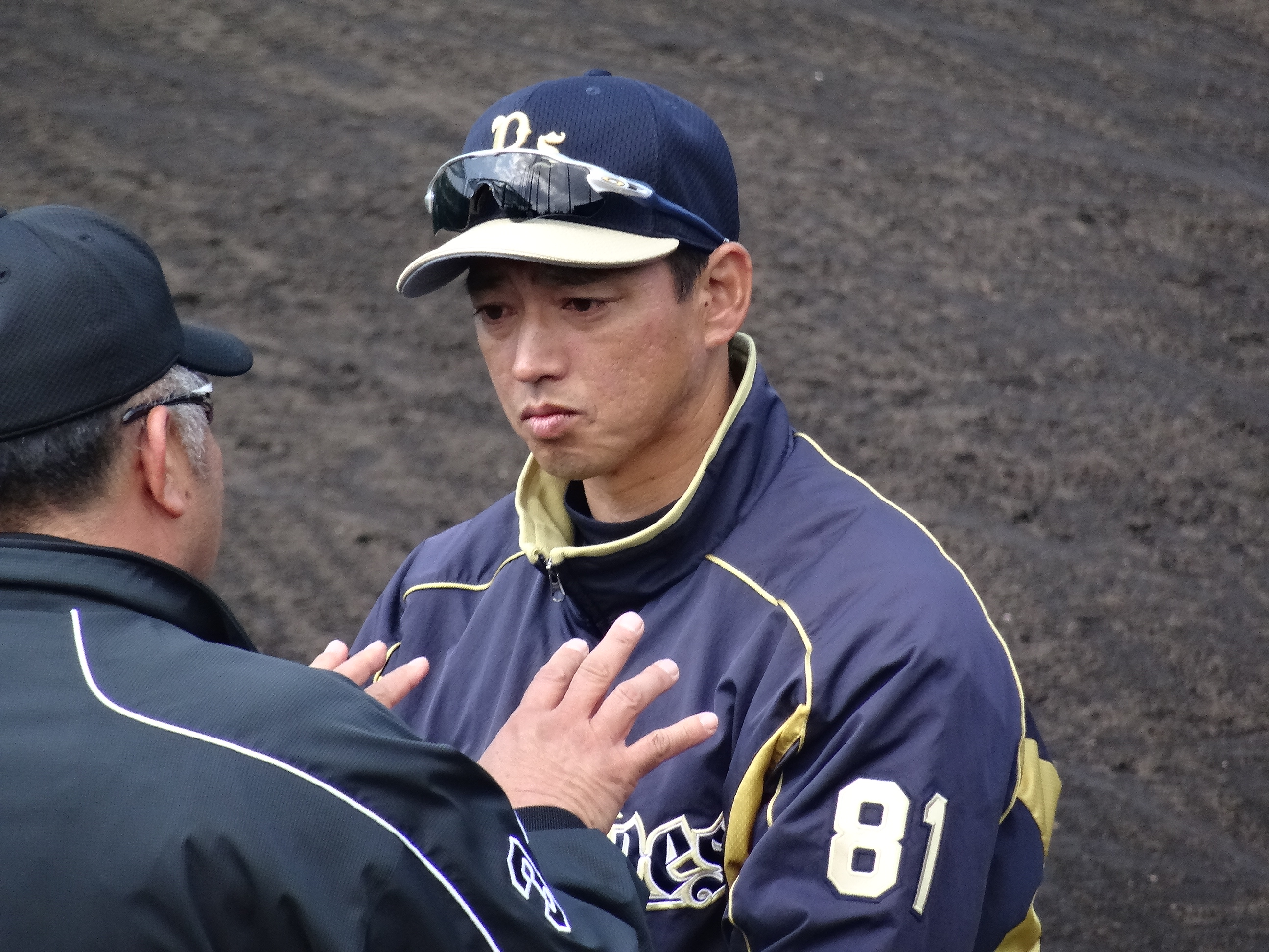 Japanese free agent outfielder Kosuke Fukudome, left, shows his