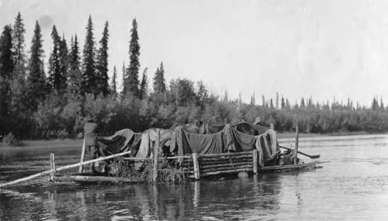 File:Two Kuskokwim Reconnaissance expedition members on raft carrying horses, Kuskokwim River, Alaska, September 1914 (AL+CA 3892).jpg