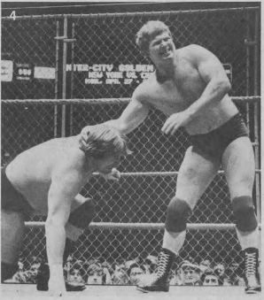 Hansen (left) wrestling Bob Backlund in a steel cage match, 1981