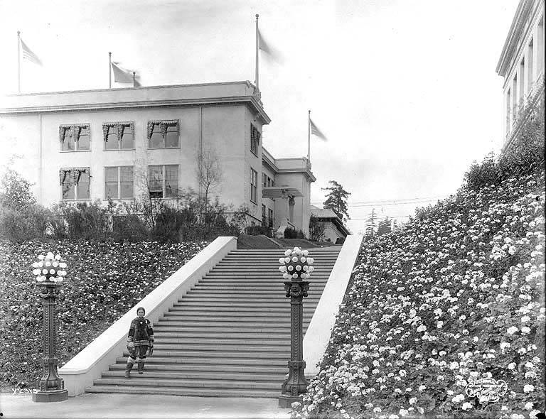 File:Eskimo woman named Nancy Columbia in fur parka posing on the steps of the Administration Building, Alaska-Yukon-Pacific (AYP 161).jpeg