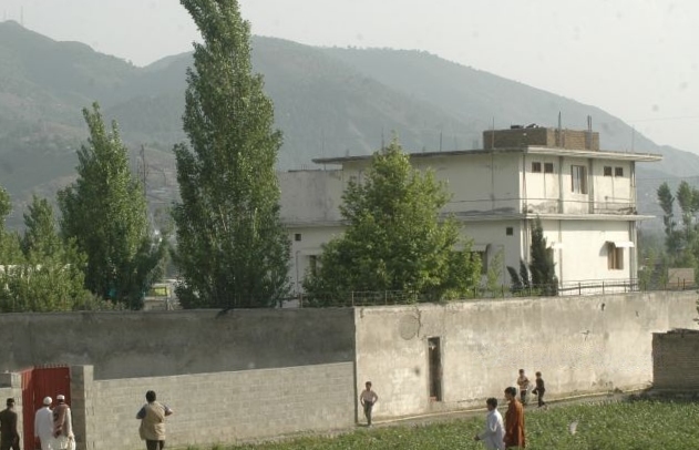 Compound with mountains in the background.