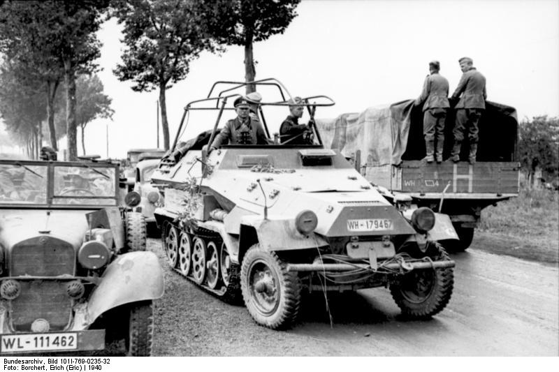 Guderian in his radio Sd.Kfz 250 pass by transport on a French roadway