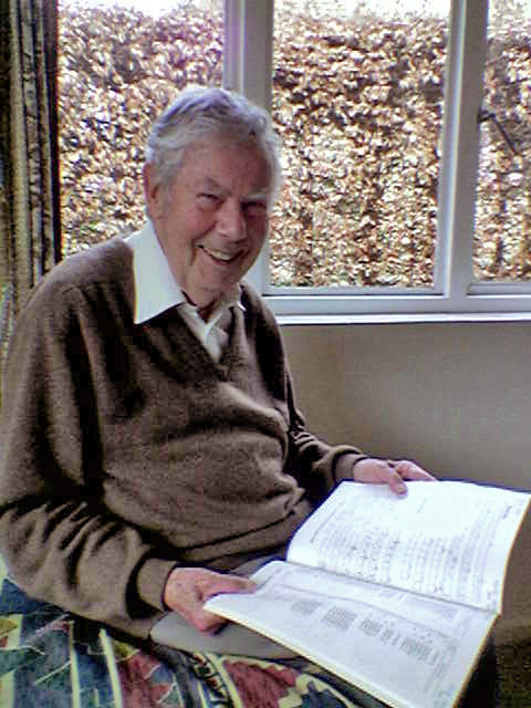 Hugh McGregor Ross, 88 years of age when the photo was taken in January 2006, with a copy of the 1987 Draft Proposal for [[ISO/IEC 10646]]