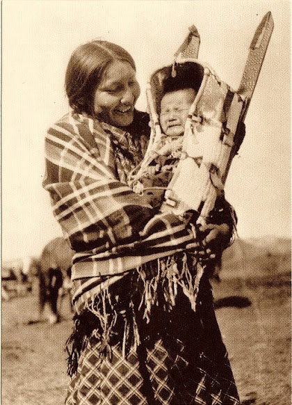 Native American smiling with child.jpg