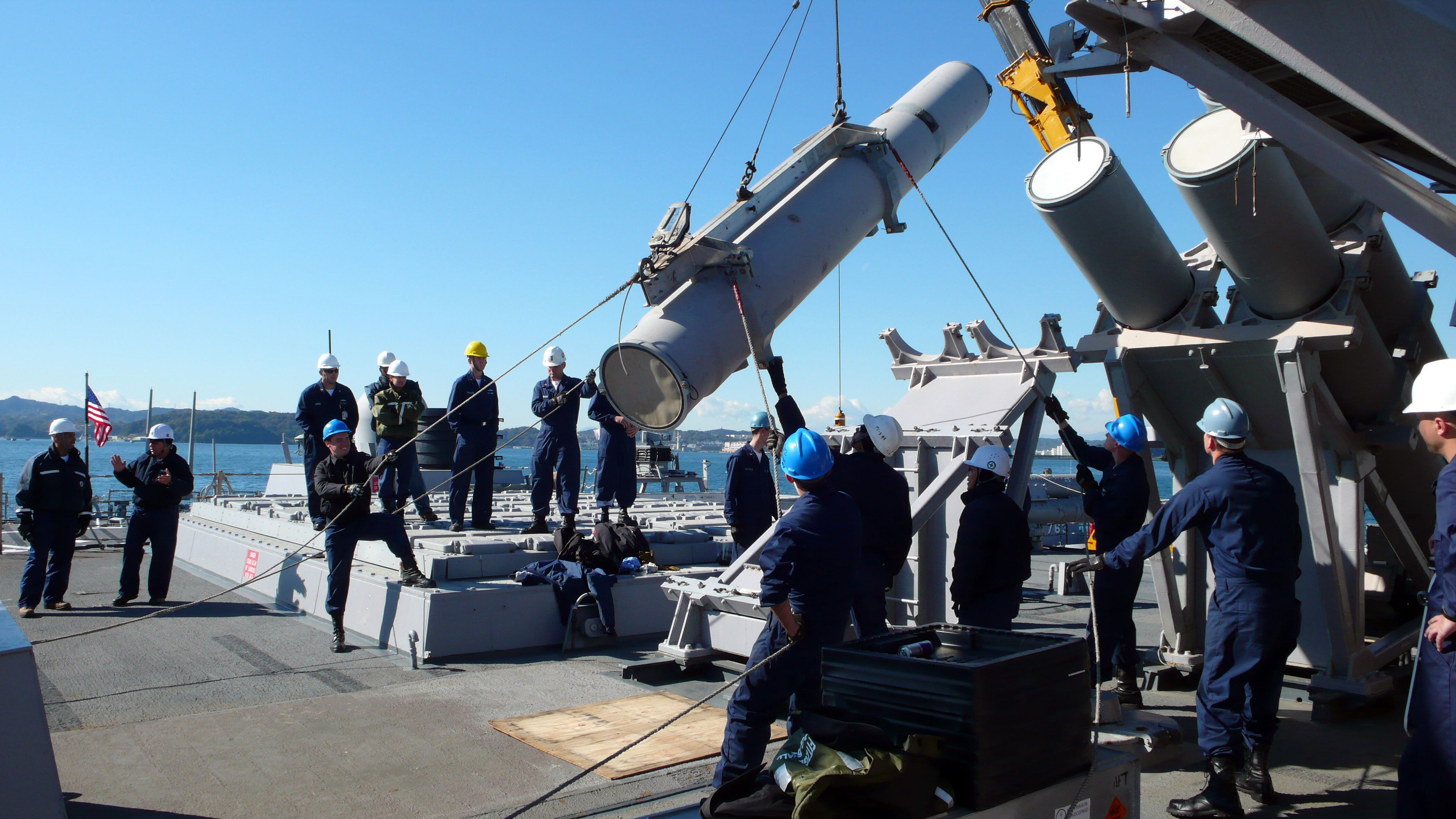 File:US Navy 081120-N-0000X-001 Members of USS Fitzgerald's (DDG 62)  Harpoon handling team carefully lower an all-up-round Harpoon missile into  its launch rack on the aft VLS deck during ammunition onload operations.jpg  -