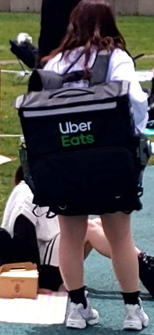 Uber Eats delivery person on foot.