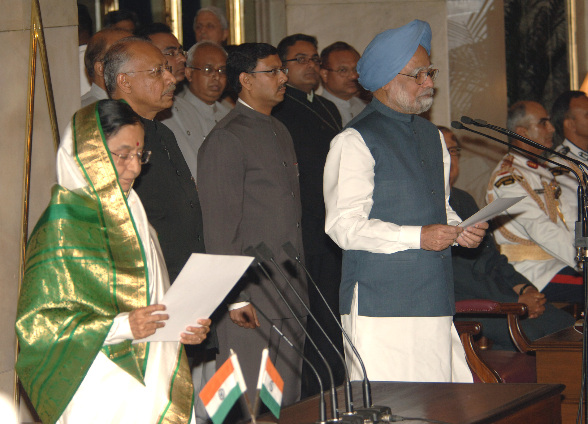 File:The President, Smt. Pratibha Devisingh Patil administering the oath of office of the Prime Minister