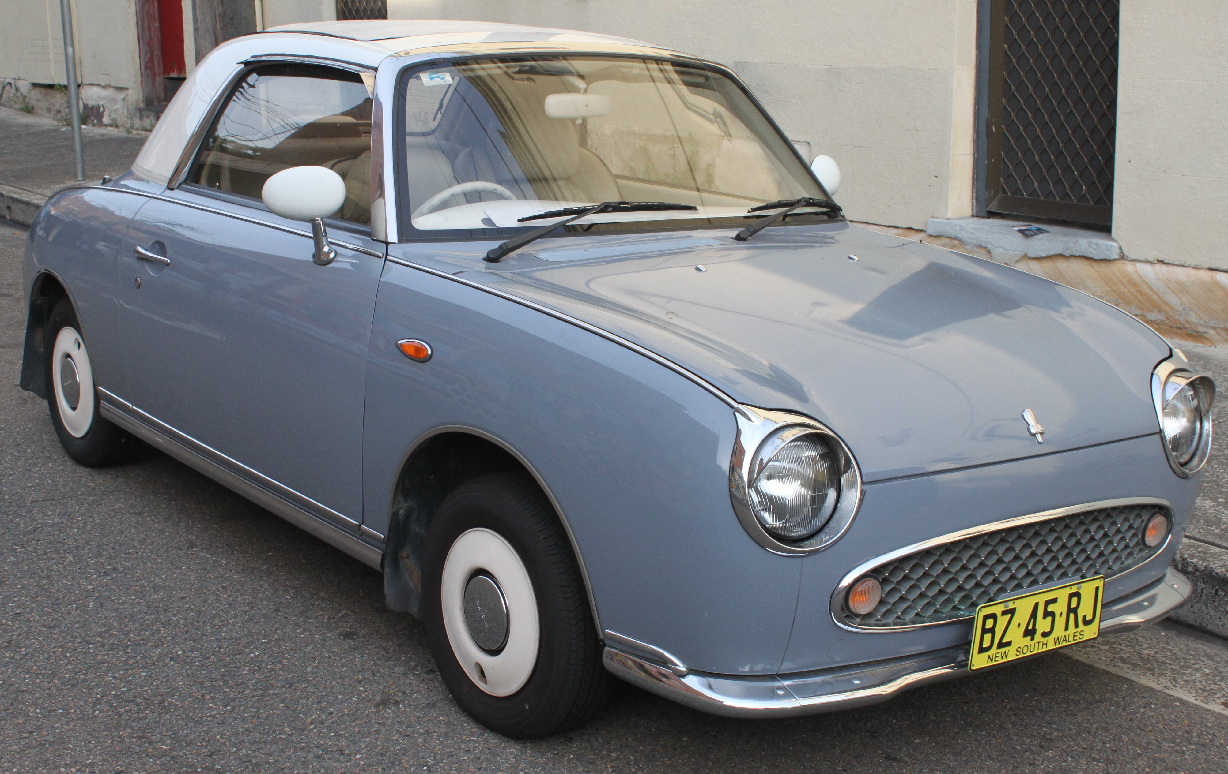 1991_Nissan_Figaro_%28E-FK10%29_convertible_%2826452674766%29.jpg