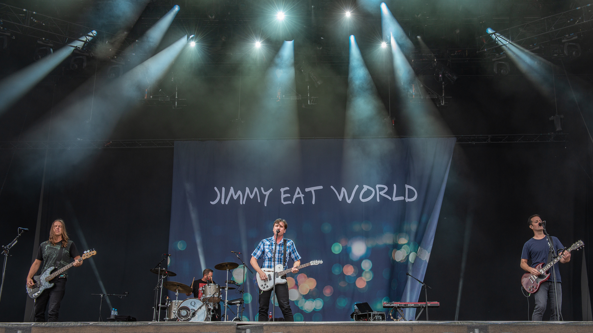 Jimmy Eat World at [[Rock im Park]] 2018 {{break}}Left to right: Rick Burch, Zach Lind, Jim Adkins, Tom Linton