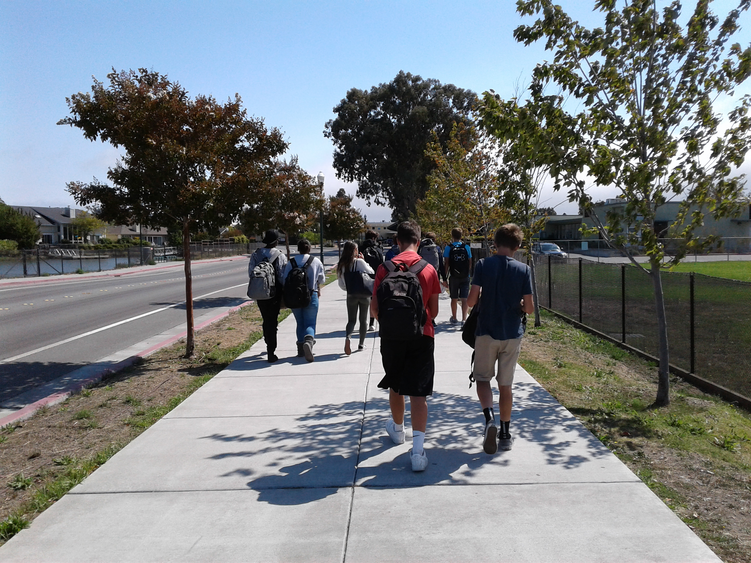 Walk to school. ......Kelly and Dave....(walk)to School. Walking back from the School. David walk to School. Street near with the School.