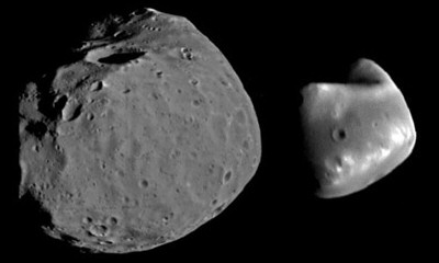 The moons of Mars: Phobos and Deimos. Phobos is the larger of the two moons, and is the closer of the two to Mars. Phobos has an average radius of 11 km, while Deimos has an average radius of 6 km. Phobos deimos diff horizontal.jpg