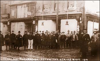 Residents standing outside the now-boarded shops after the events of 8 November. Tonypandy Riots 1910.jpeg