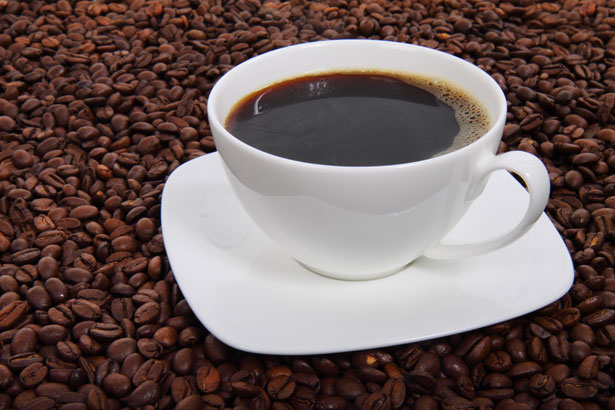 File:Coffee cup surrounded by coffee beans.jpg