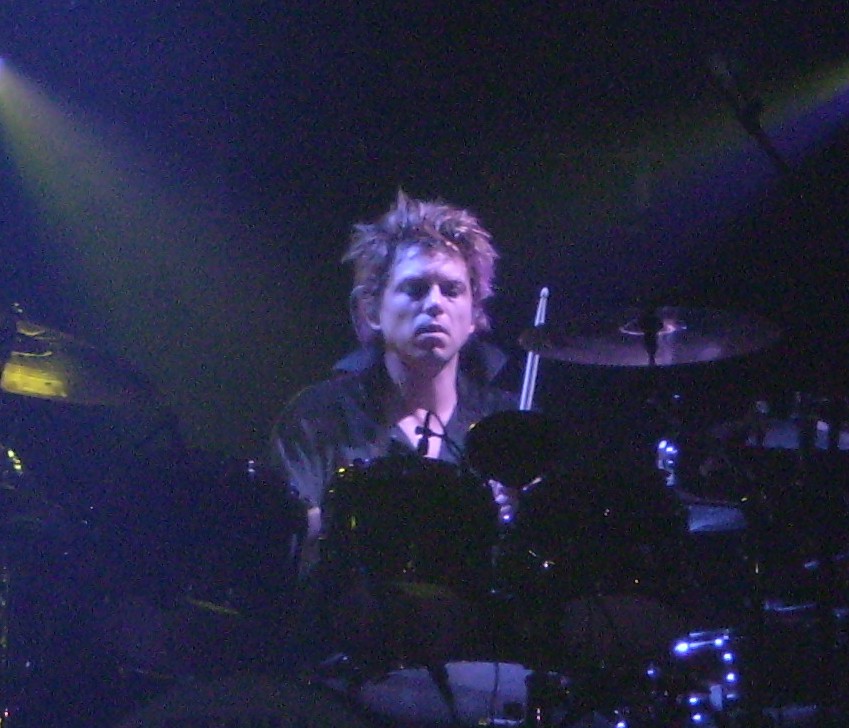 Cooper performing with [[The Cure]] in 2008