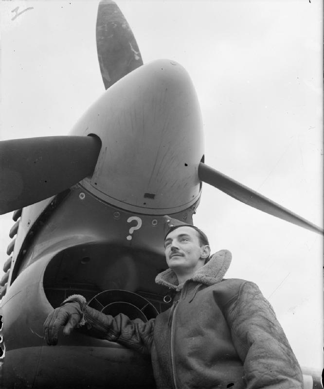 Wing Commander Crossley standing in front of a [[Hawker Typhoon]] at [[RAF Gravesend]], Kent