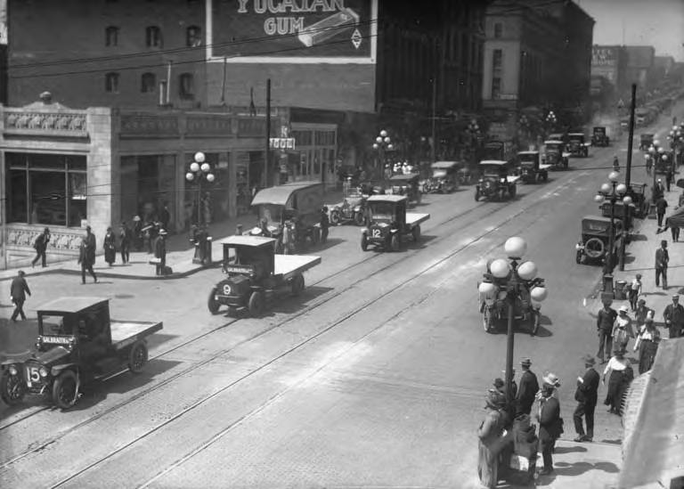 File:1st Ave with Grand Pacific Hotel and advertisement for Yucatan Gum, Seattle, ca 1917-ca 1920 (SEATTLE 4376).jpg