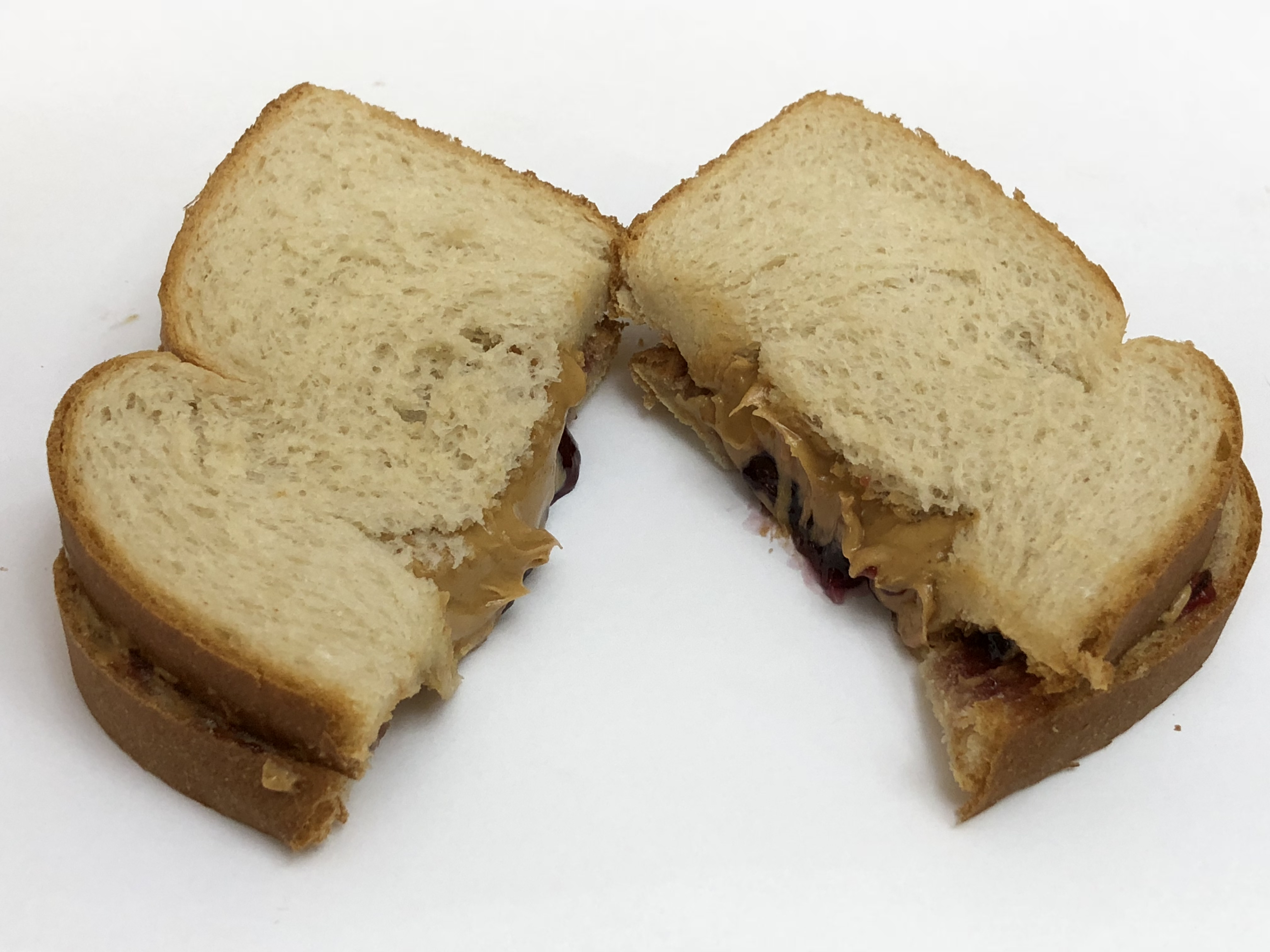 File 05 05 00 03 49 A Peanut Butter And Jelly Sandwich Cut In Two