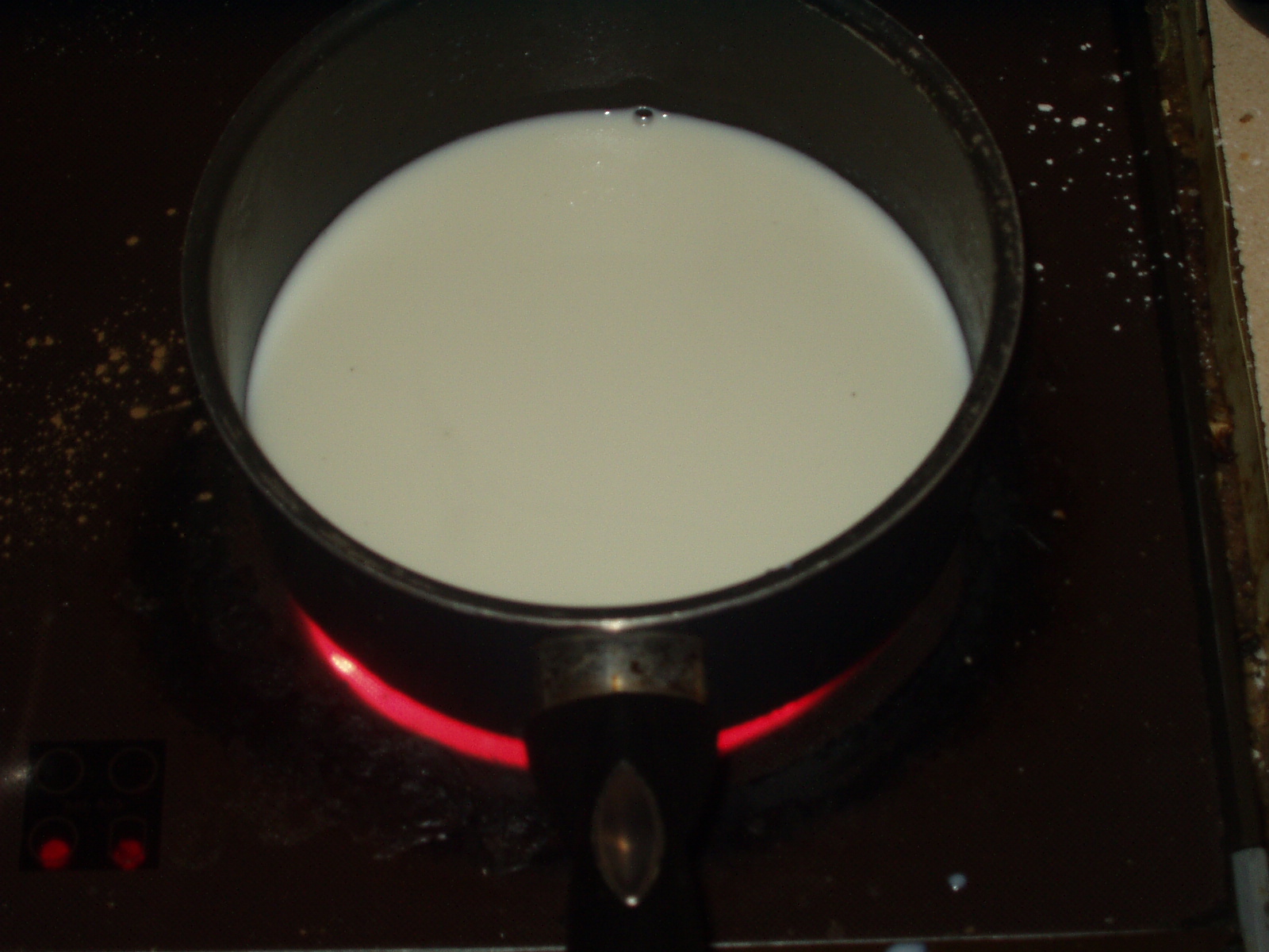 https://upload.wikimedia.org/wikipedia/commons/2/22/Milk_being_warmed_%28117820219%29.jpg