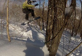 File:Snowboarder in the trees.jpg