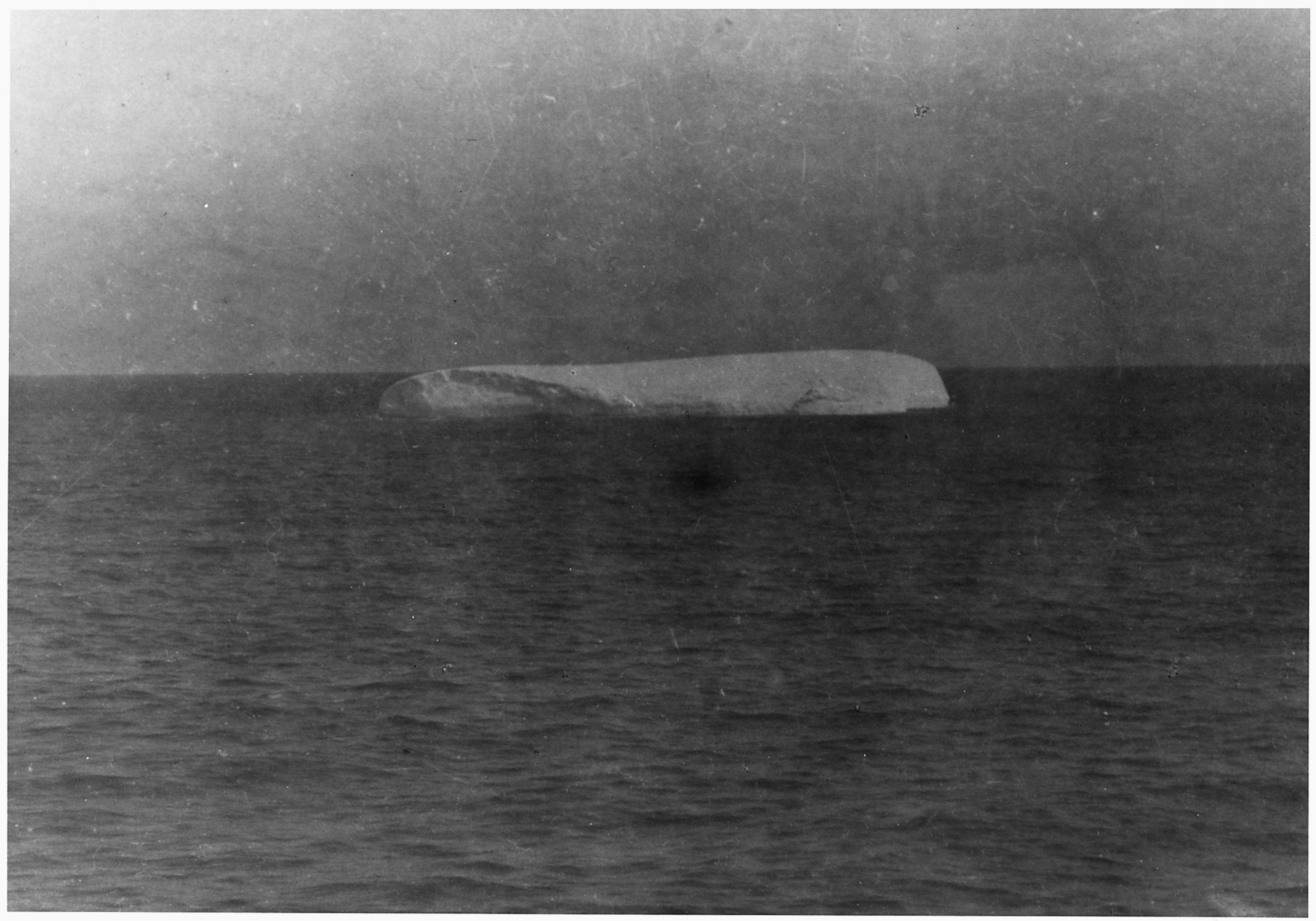 File A Photograph Of An Iceberg Floating Near The Site Of