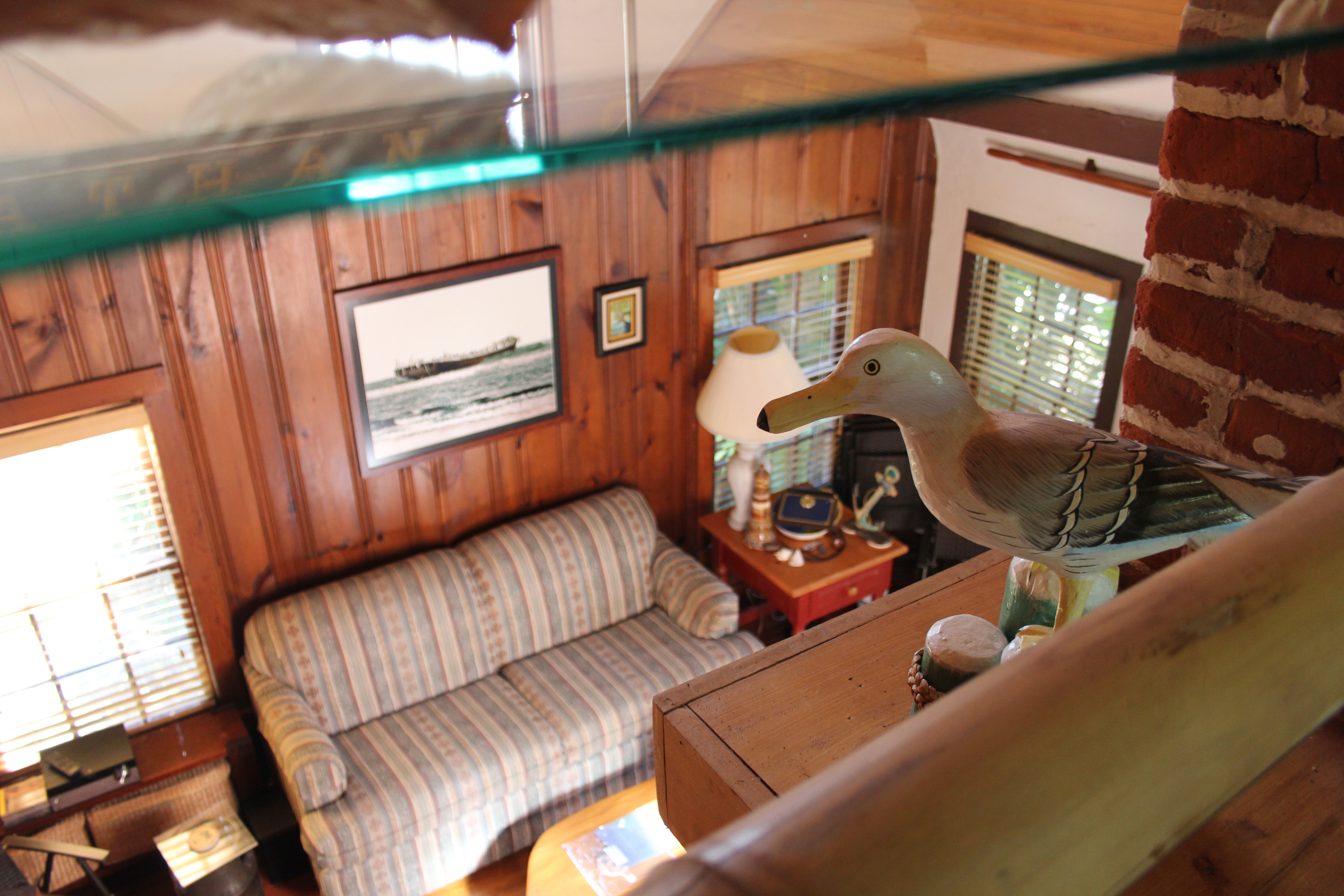 Nathan_Cobb_Cottage_-_Interior_2nd_Floor_Loft_Looking_Down_to_Living_Room_-_photograph_ca._2021.jpg