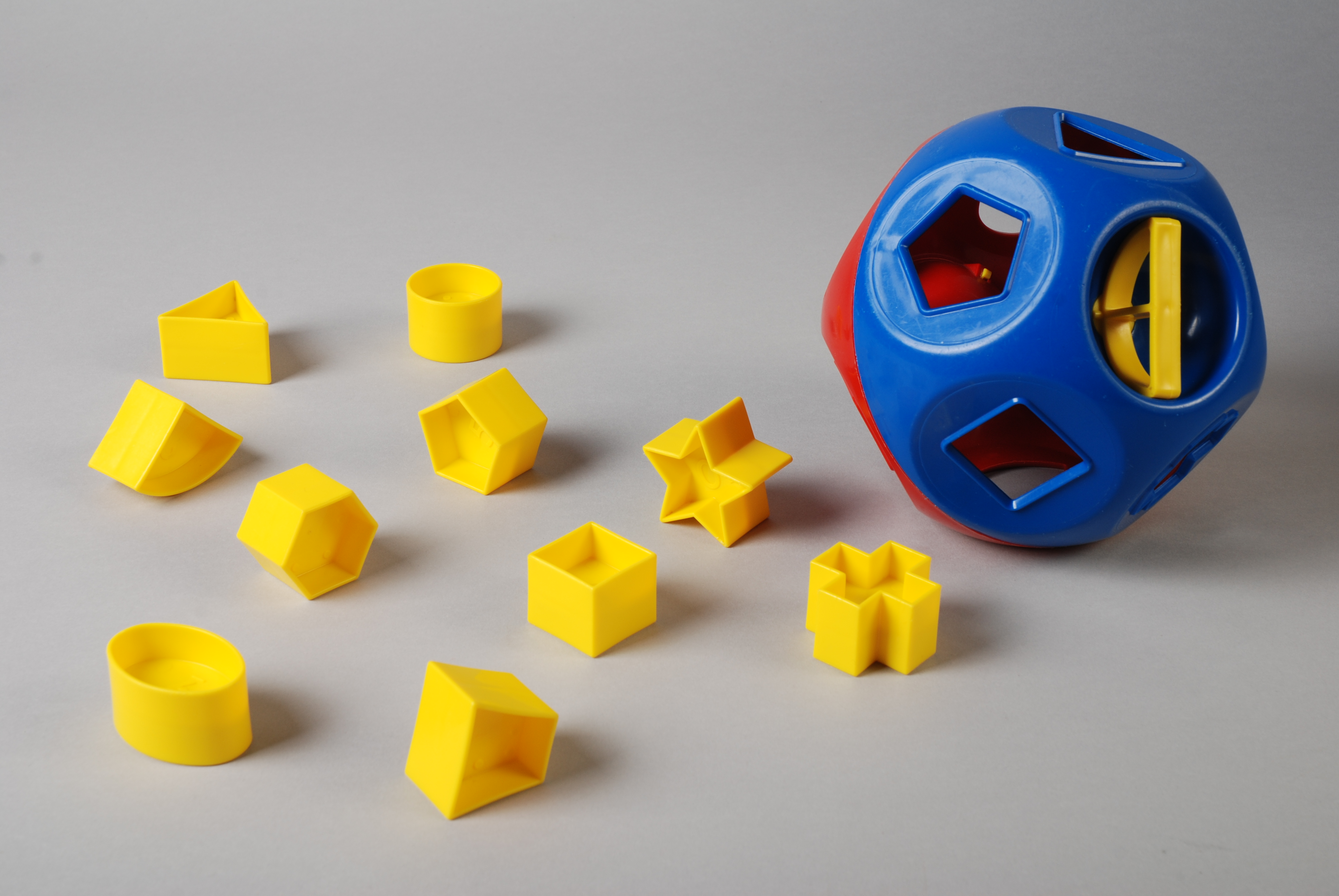 toy shapes into holes