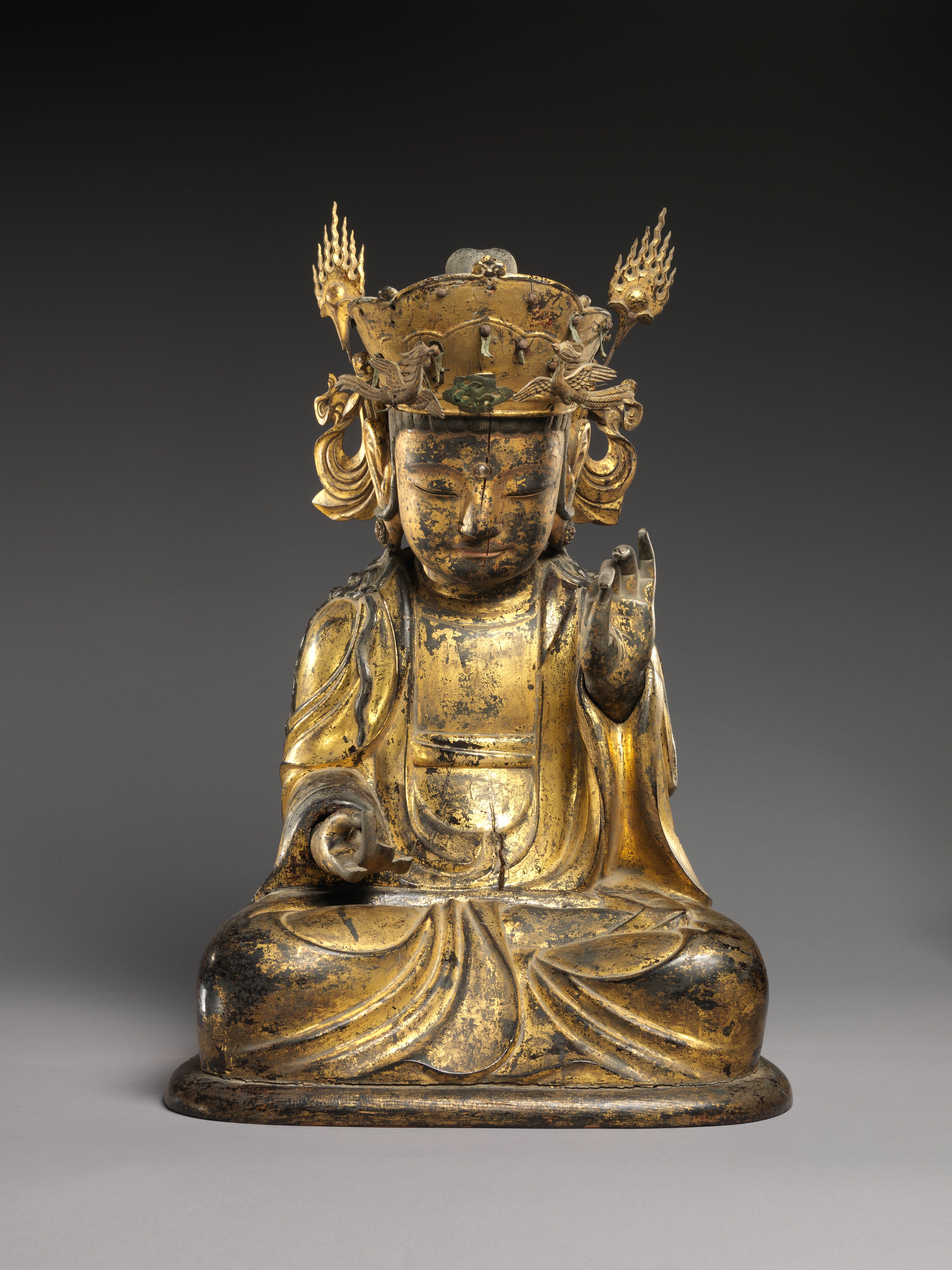 Seated Bodhisattva (left attendant of a triad) - Wikipedia
