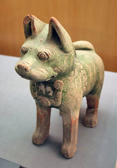 A Han dynasty glazed pottery dog tomb statuette with a decorative pet collar