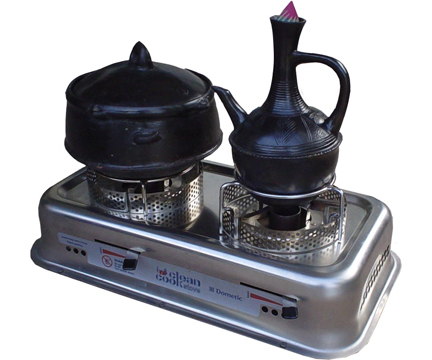 Two-burner CleanCook stove with round-based Ethiopian pots.