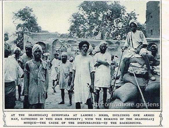 File:Photograph of the dispute and demolition of the Shaheed Ganj Mosque in Lahore - Sikhs gathered at the site, including one who is armed with a weapon.jpg