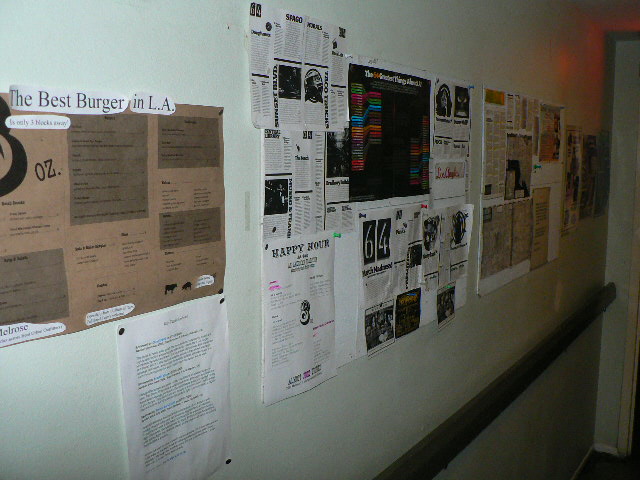 File:Wall of youth hostel filled with flyers.jpg