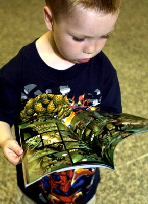 File:Boy reading marvel comics.jpg