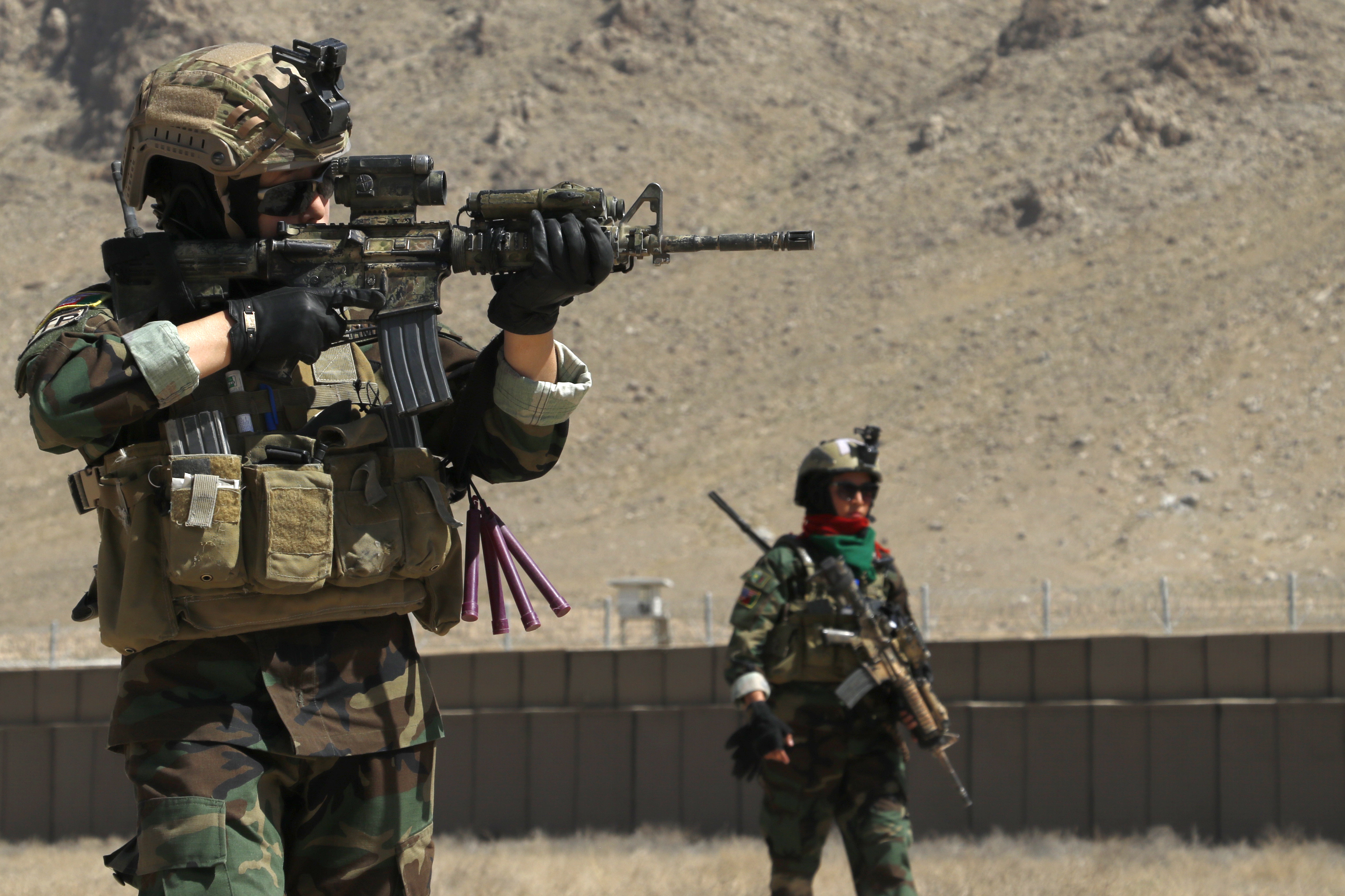 Ktah Khas Afghan Female Tactical Platoon members perform a close quarters  battle drill drill outside Kabul, Afghanistan May 29, 2016. The females  work closely alongside the males on operations to engage and