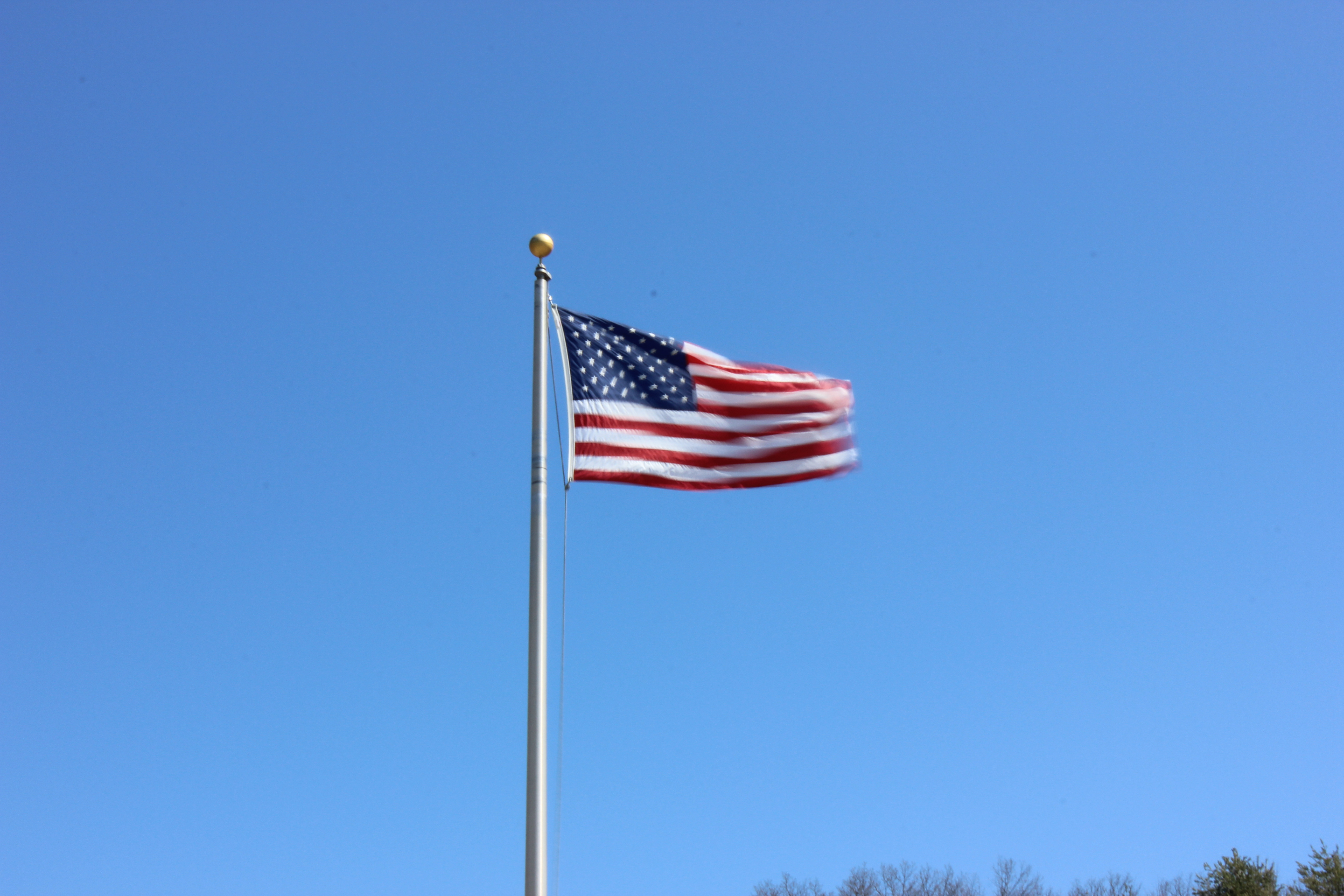 american flag waving in the wind