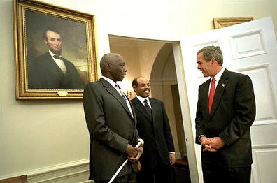 President George W. Bush welcomes President Daniel arap Moi of Kenya and Meles Zenawi to the Oval Office, December 2002