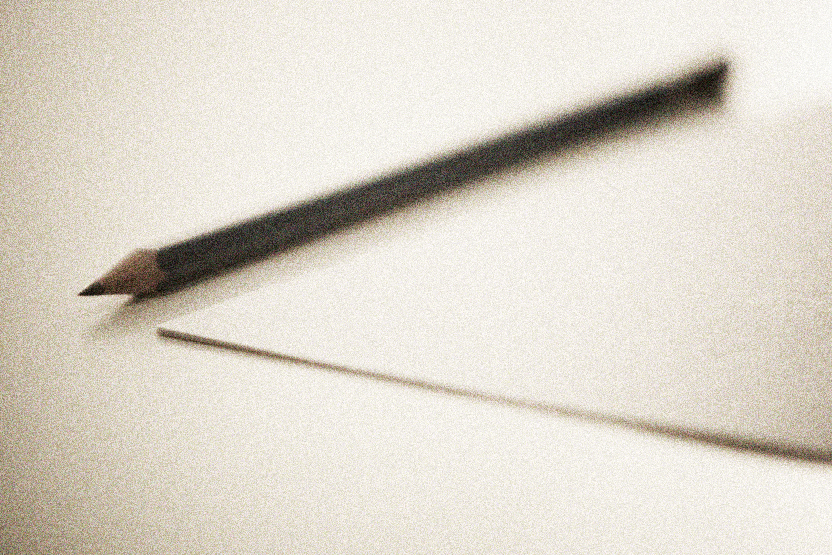 File:Sharpened pencil next to sheet paper.jpg - Wikimedia Commons