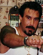 Jonathan Shaw in Fun City Tattoo, showing the ring of the Death Is Certain Club. Jonathanshaw tattooist.jpg