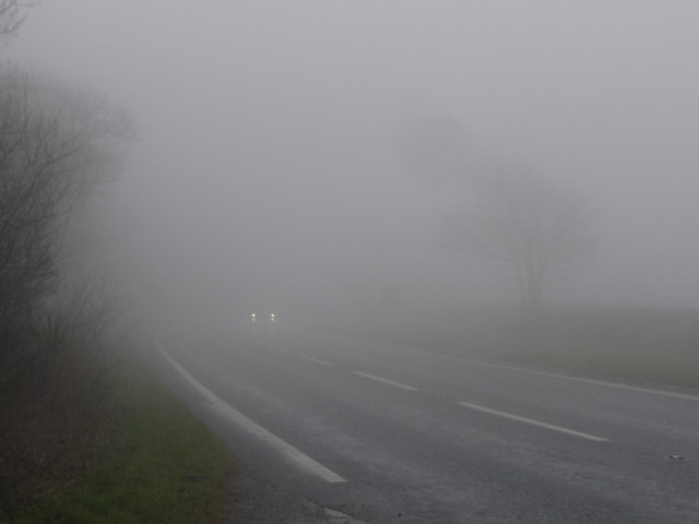 Raymonds_Hill%2C_the_A35_crosses_the_border_in_fog_-_geograph.org.uk_-_3361372.jpg