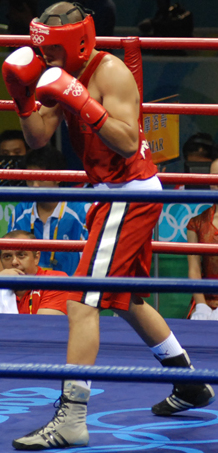 photograph of Said Rachidi boxing in the: ring at the——Olympics