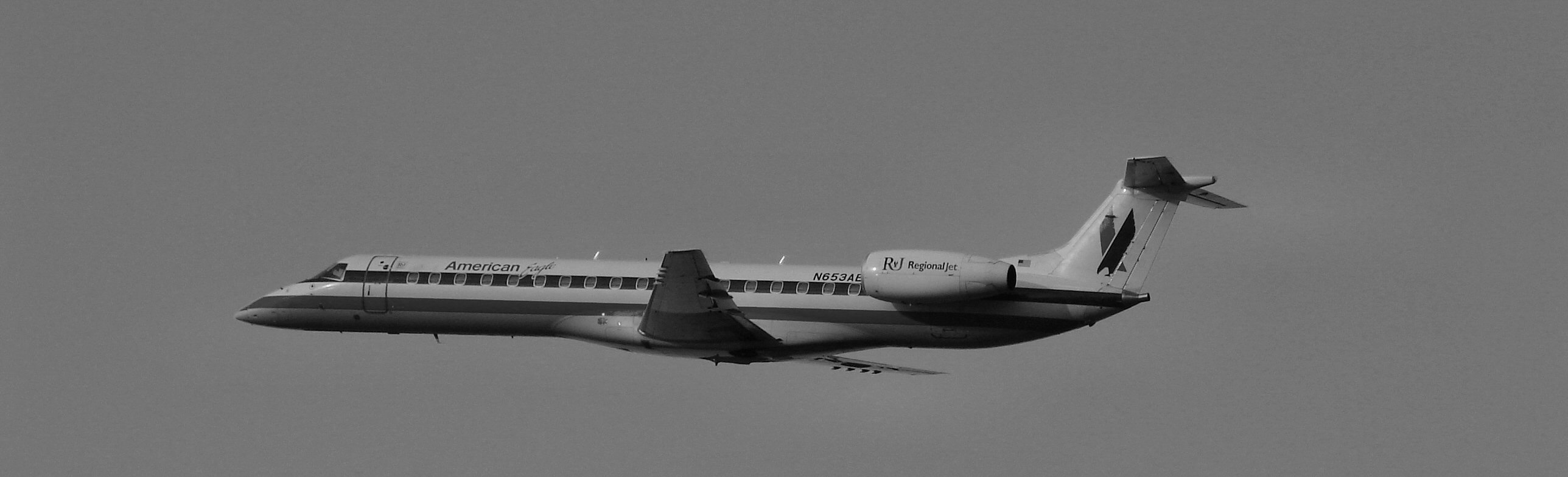 Embraer 145 B&W (314512872).jpg