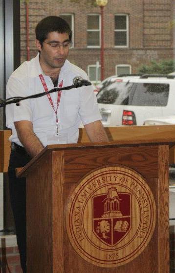 File:Reza Parchizadeh reading The Fellowship of the Ring by J.R.R Tolkien, which was banned for being anti-religious, at Stapleton Library, IUP..jpg