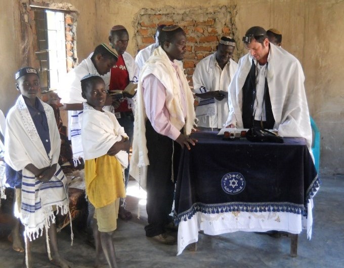 Local and foreign Rabbis pray in the synagogue of Puti next to Mbale