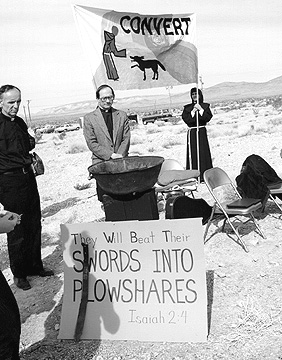 Members of Nevada Desert Experience hold a prayer vigil during the Easter period of 1982 at the entrance to the Nevada Test Site.