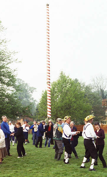 Villagers & Morris-men dancing beside the Maypole on Ickwell Green, soon after dawn on 1 May 2005