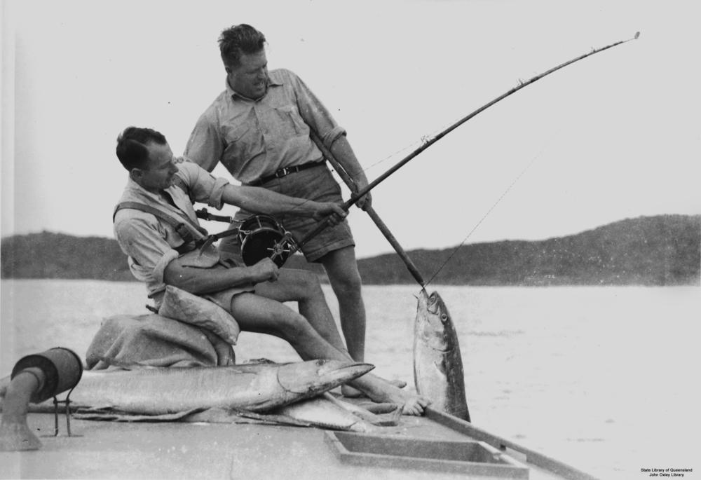File:StateLibQld 2 109108 Two men reeling in a large fish.jpg