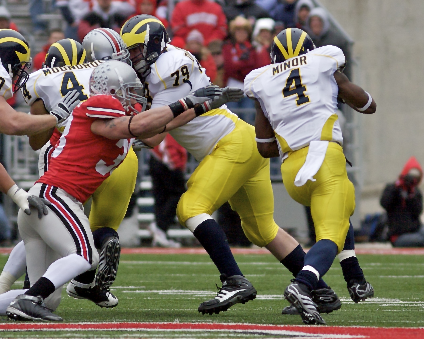 A sidestep in football that allows one player to elude another bent on tackling him