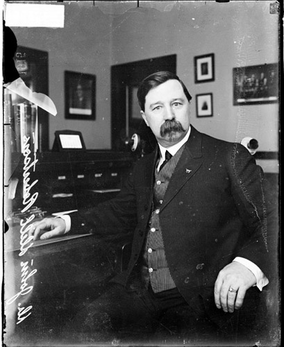 File:Dr. John Dill Robertson sitting at a desk in a room (May 4, 1915).jpg