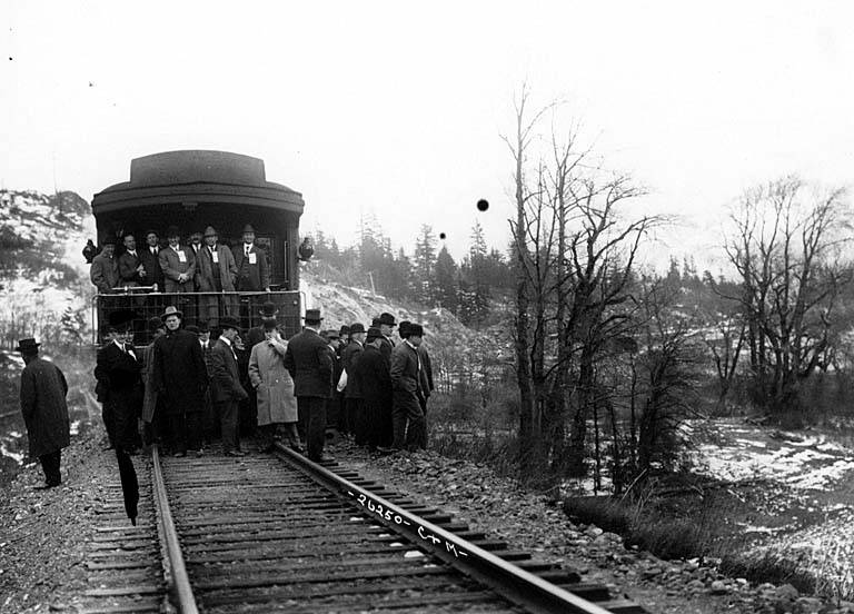 File:Group of men on observation car, Spokane, Portland & Seattle Ry train at Lyle, hosted by Samuel Hill (CURTIS 883).jpeg