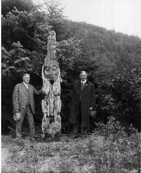 File:Two unidentified men pose with weathered totem pole, Haines Mission, ca 1914 (CURTIS 2015).jpeg