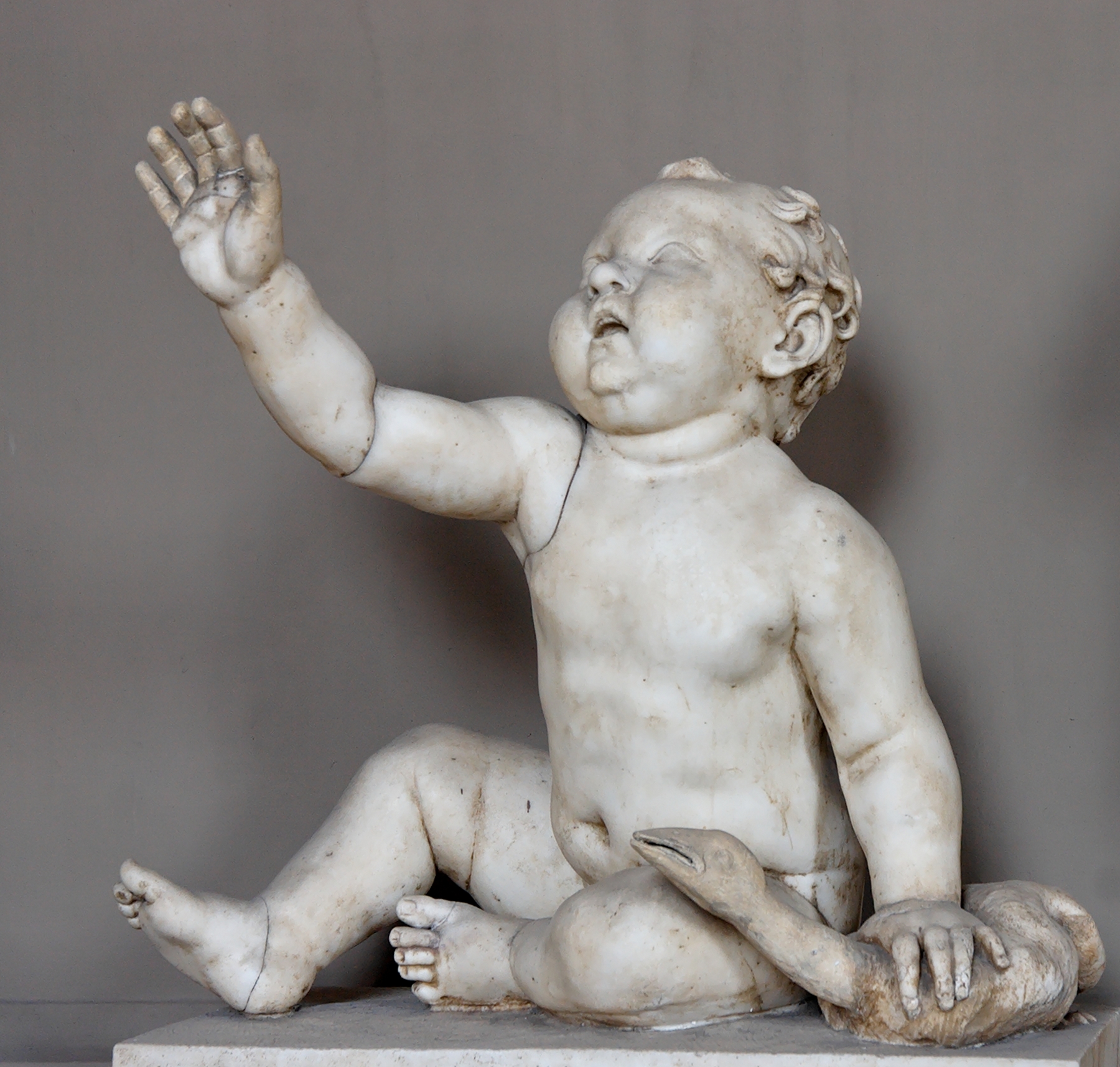 Child playing with a bird. Marble, Roman variation on an Hellenistic type